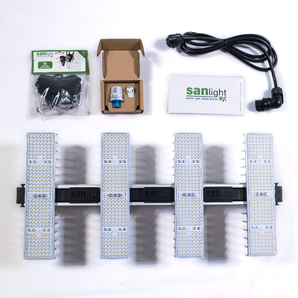 LED Growlampe im Set. Im Set dabei sind die LED Growlampe mit vier länglichen, schmalen Lampen mit integrierten LEDs, ein schwarzes Netzteil, zwei Stück Aufhängungen und ein Dimmer für die Beleuchtung.